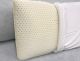 latex foam pillow with cover half on